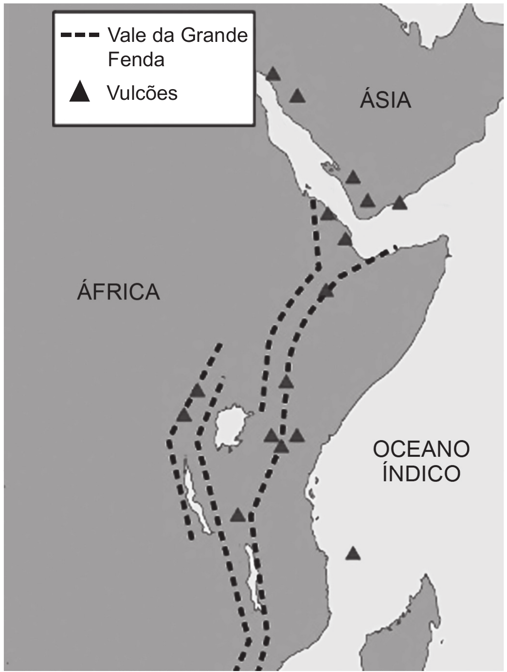 Mapa do leste da África e da península Arábica, com os continentes em cinza e o mar em branco. Duas faixas tracejadas grossas descem em paralelo do mar Vermelho até o sul do continente, abrindo-se em ramos em torno de um lago; dezenas de triângulos pretos se alinham ao longo delas. Rótulos identificam ÁFRICA, ÁSIA e OCEANO ÍNDICO, e uma caixa no alto traz a legenda.

Legenda: linha tracejada — Vale da Grande Fenda; triângulo — Vulcões.