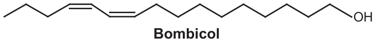Fórmula estrutural em bastão do bombicol: cadeia carbônica longa com duas ligações duplas consecutivas (dieno conjugado) perto de uma das extremidades e um grupo OH na outra extremidade; legenda “Bombicol”.