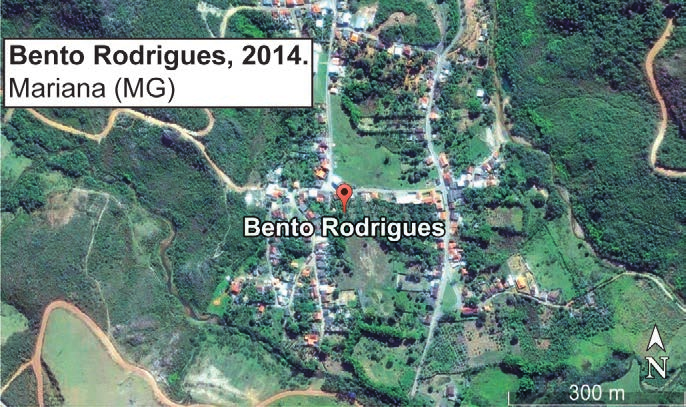 Imagem de satélite: Bento Rodrigues, 2014. Mariana (MG).
Imagem com construções entre áreas verdes, marcador Bento Rodrigues, seta N e escala de 300 m.