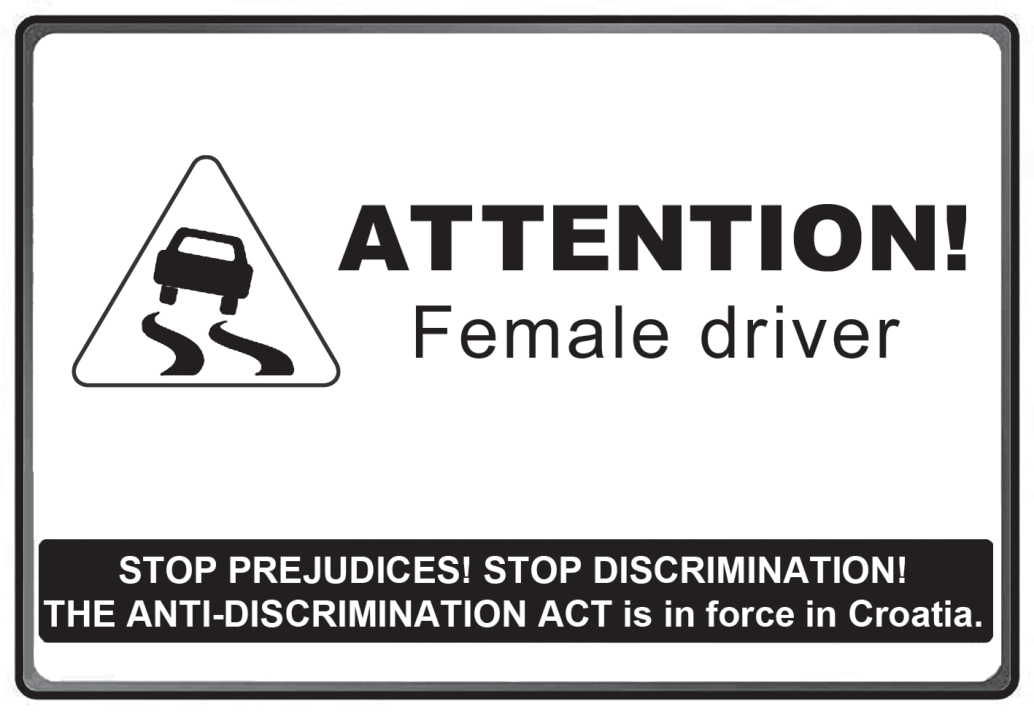 Pôster em forma de placa de trânsito: à esquerda, um triângulo de advertência com um carro derrapando; ao lado, em letras grandes, 'ATTENTION!' e, abaixo, 'Female driver'. Na parte inferior, uma tarja preta com o texto em branco: 'STOP PREJUDICES! STOP DISCRIMINATION! THE ANTI-DISCRIMINATION ACT is in force in Croatia.'